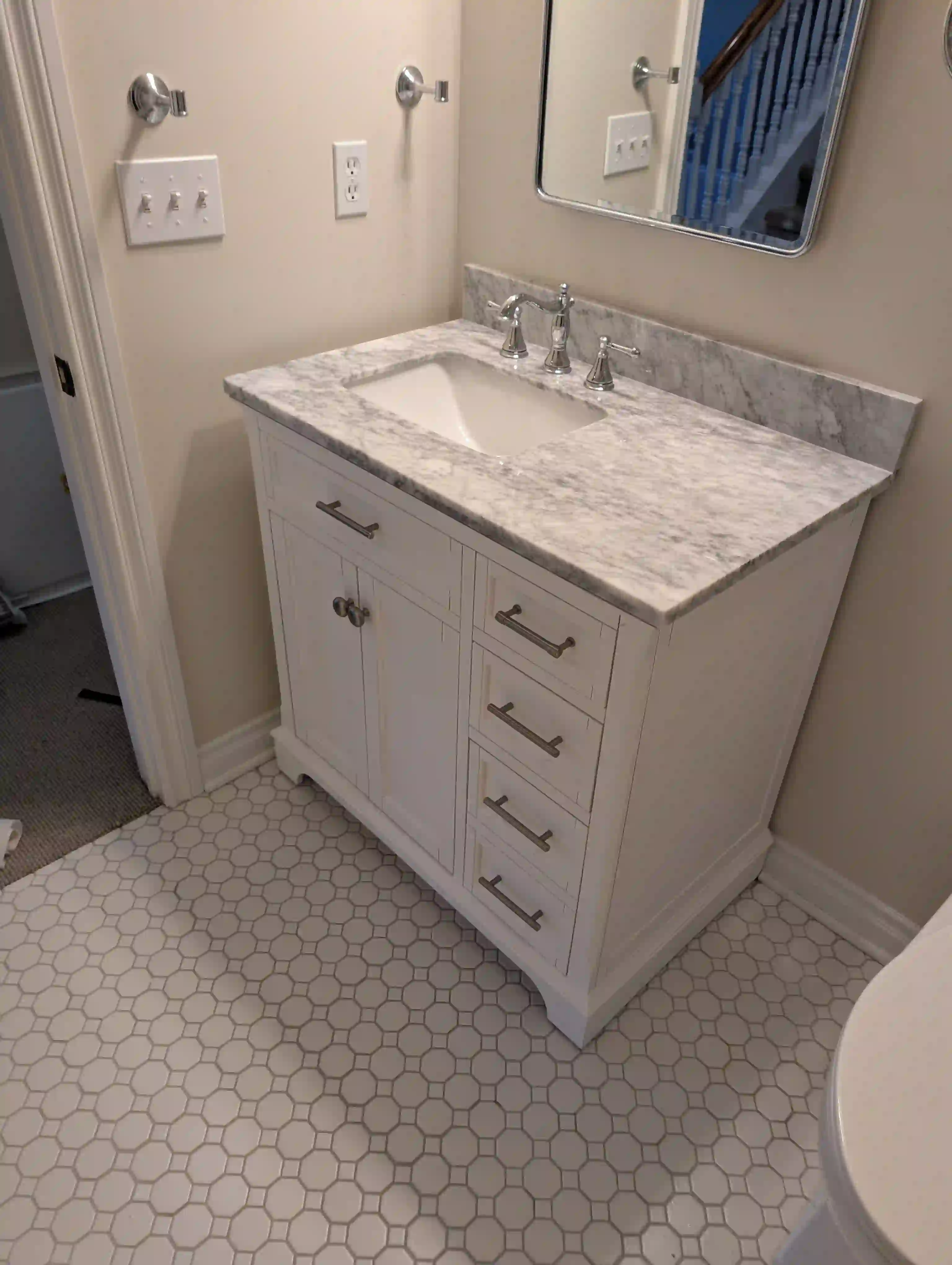 New white shaker vanity with Carrara marble top installed — Cedar, MI