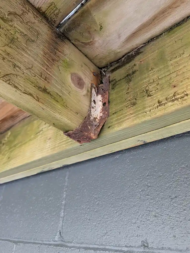 Rusty joist hangers on a deck in Northern Michigan