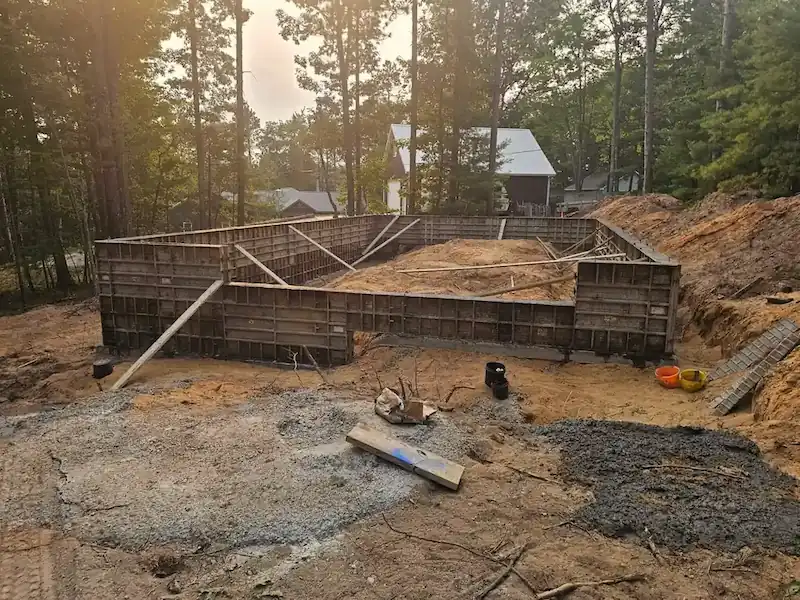 Foundation crack evaluation during an owner's representative site visit in Northern Michigan